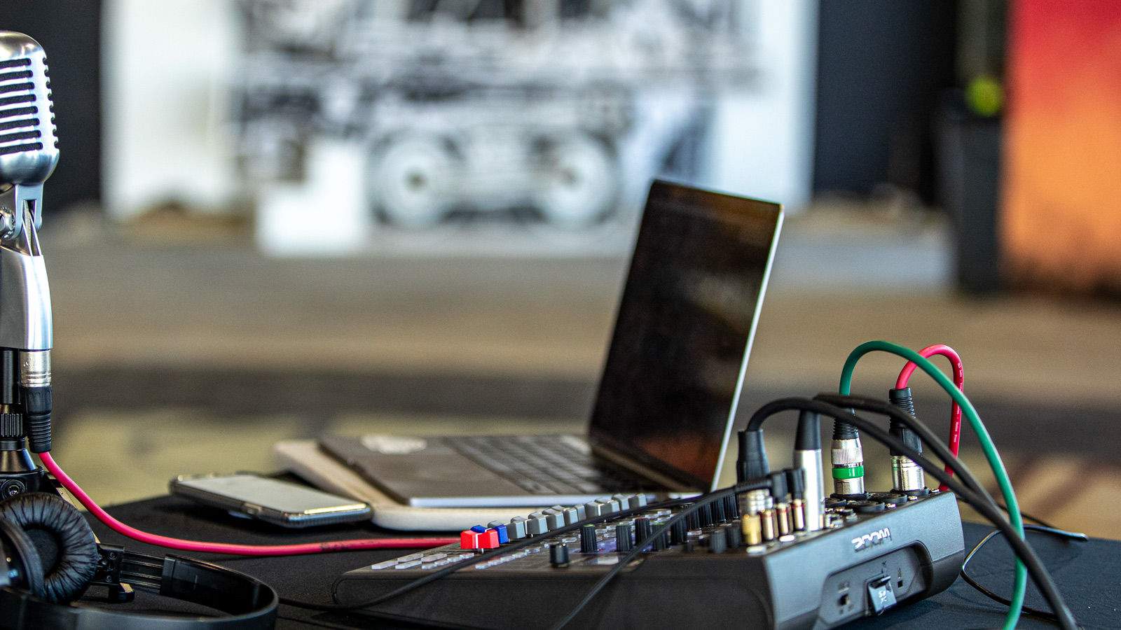 LiveTrak L-8 Sitting on table with microphone and computer