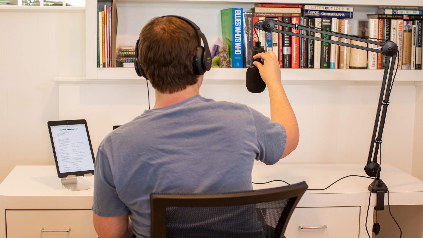 Podcaster using the ZMA-1 with his microphone