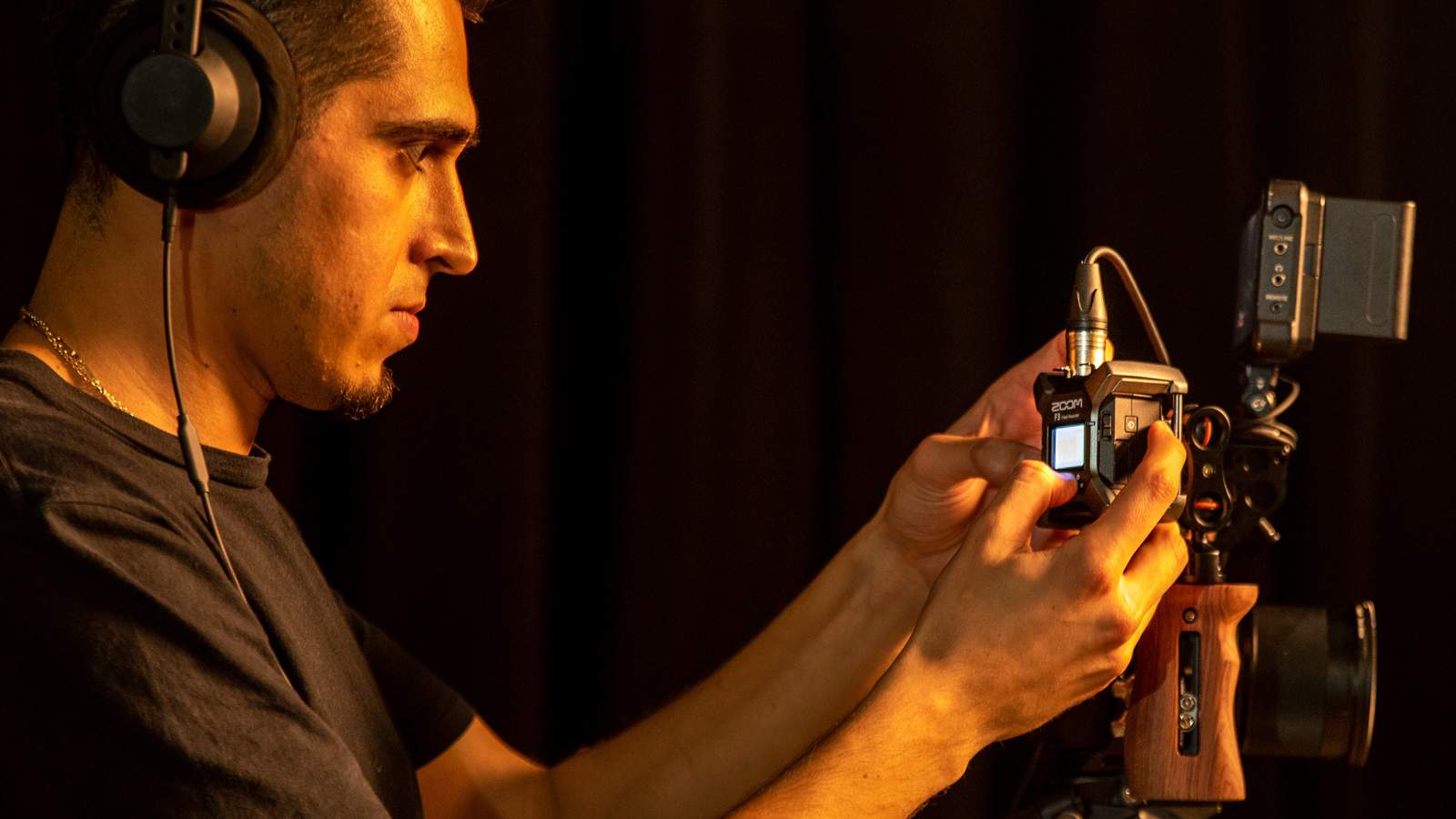 Videographer attaching F3 to his camera rig