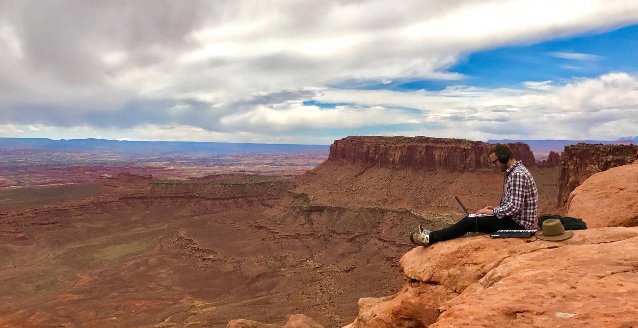 Ross Lara capturing audio on a mountain