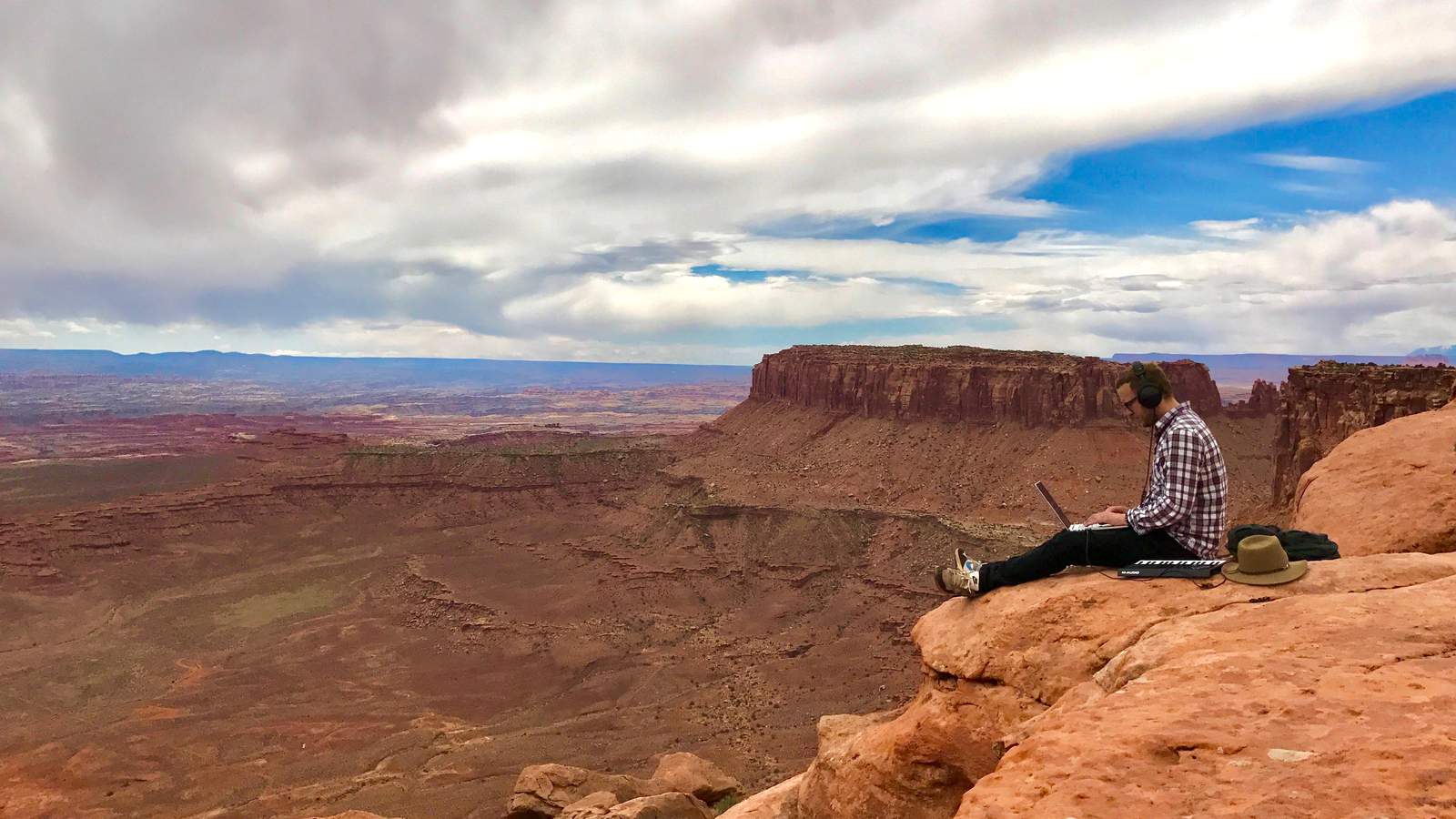 Ross Lara capturing audio on a mountain