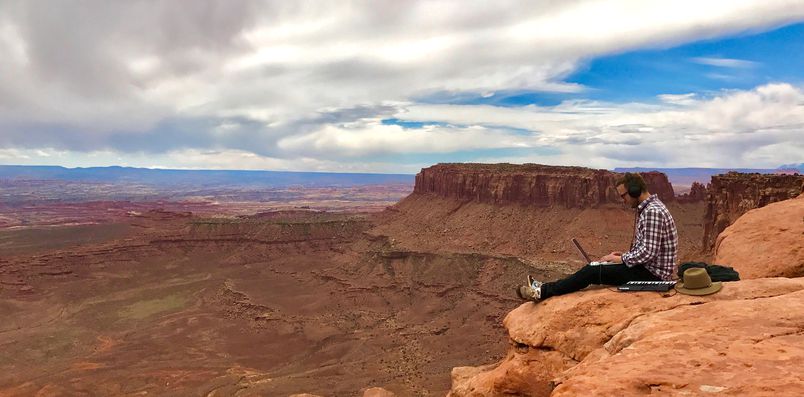 Ross Lara capturing audio in a canyon