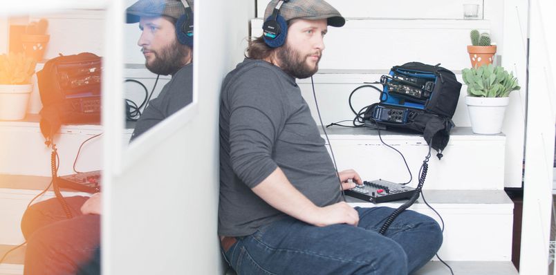 Sound man monitoring  audio and making adjustments through the F-Control