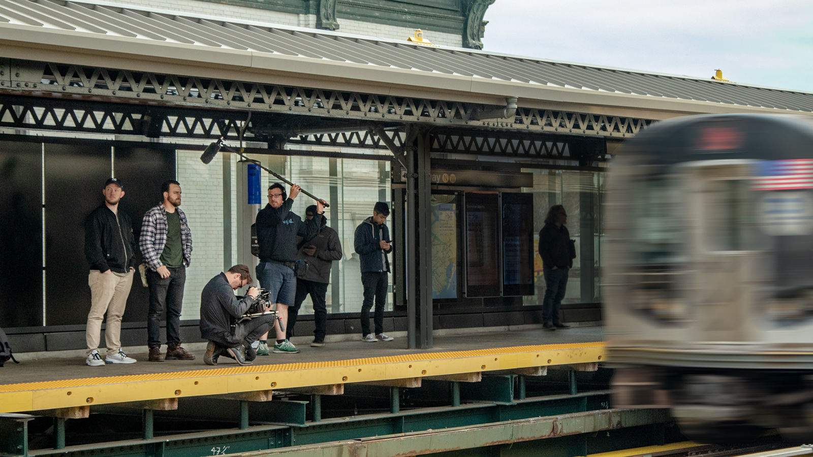 moving train with people recording audio